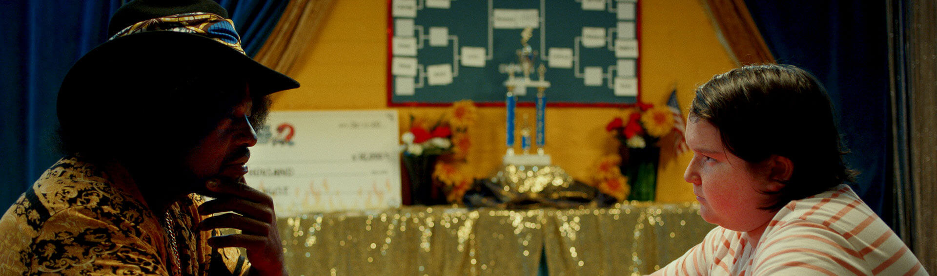 Domino: Battle of the Bones movie promo still Promotional movie still from Domino: Battle of the Bones.